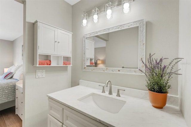 bathroom featuring hardwood / wood-style floors and vanity