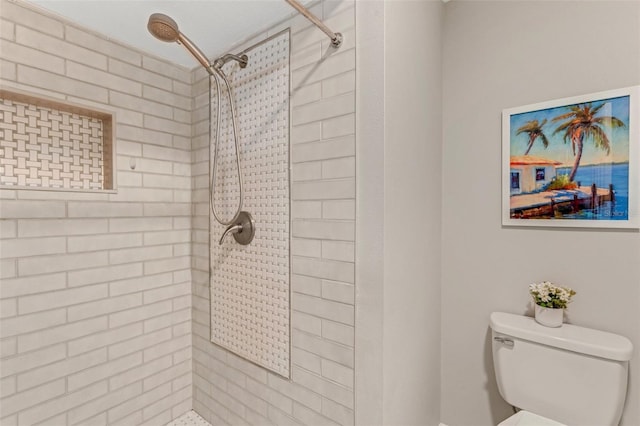 bathroom with toilet and tiled shower