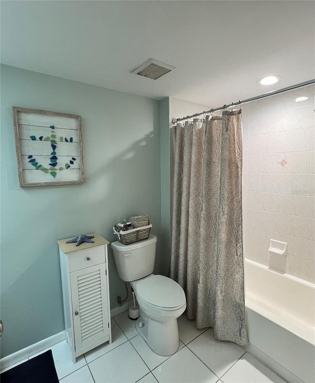 bathroom with tile patterned flooring, toilet, and shower / tub combo