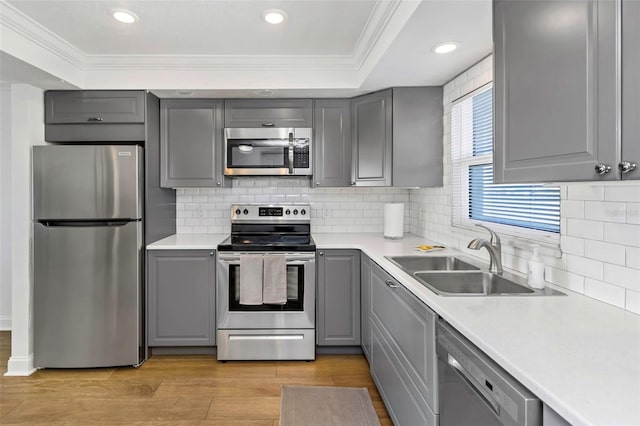 kitchen with gray cabinets, sink, and stainless steel appliances