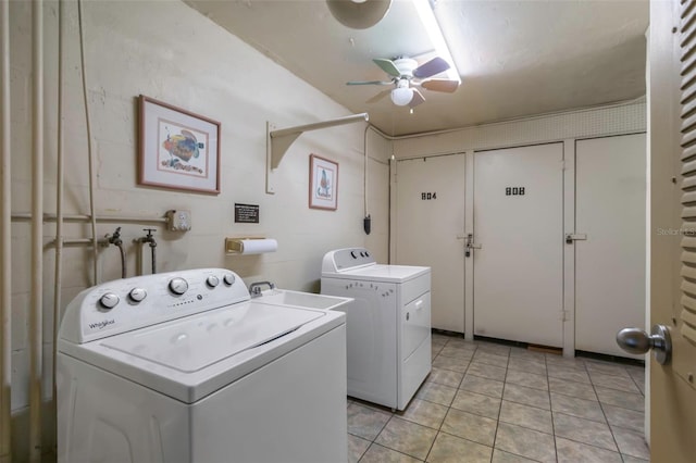 washroom featuring ceiling fan, washer and clothes dryer, light tile patterned floors, and sink