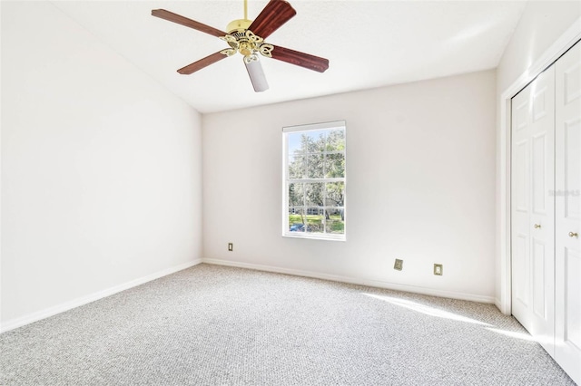 unfurnished bedroom featuring carpet floors, a closet, and ceiling fan