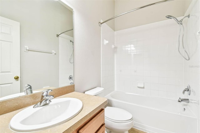 full bathroom featuring vanity, bathtub / shower combination, and toilet