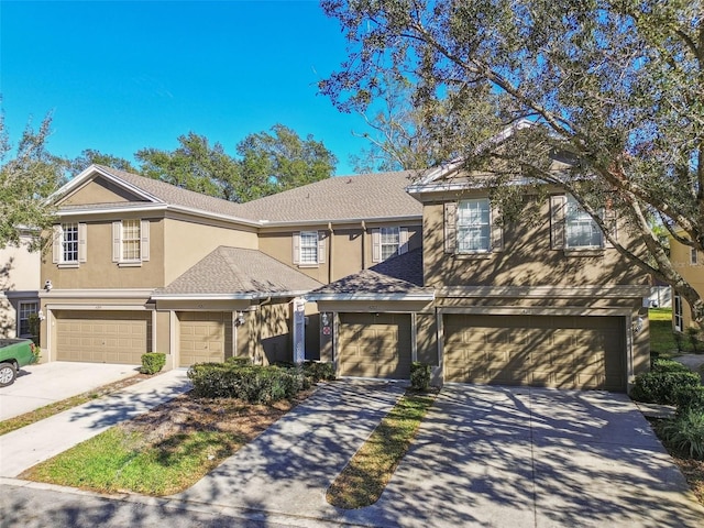 4207 Key Thatch Dr, Tampa, FL 33610 - multi unit property featuring stucco siding, concrete driveway, and an attached garage