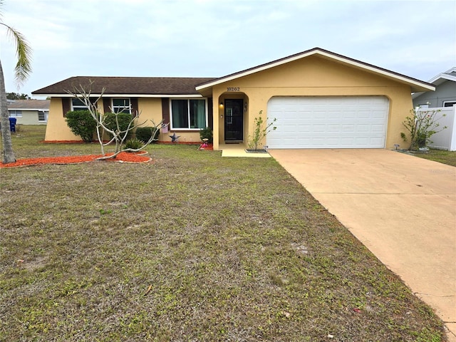 ranch-style home featuring a garage and a front lawn