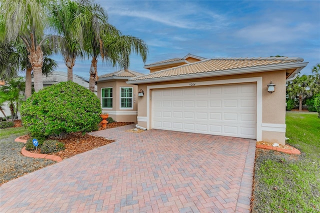 view of front of property with a garage