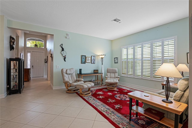 living room with light tile patterned floors