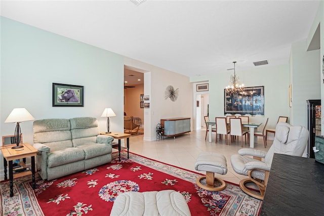 living room featuring tile patterned flooring and a chandelier