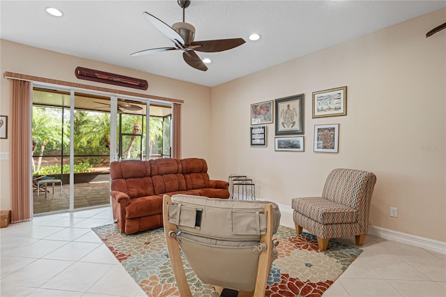 living room with ceiling fan and light tile patterned flooring