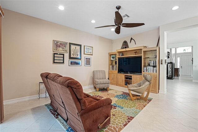 tiled living room featuring ceiling fan