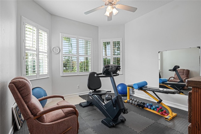 exercise area featuring ceiling fan and a healthy amount of sunlight