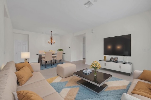 living area with light tile patterned flooring, a chandelier, and visible vents
