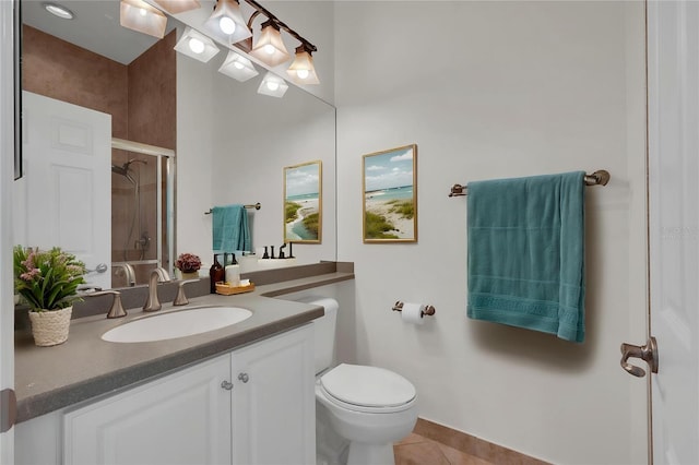 bathroom with toilet, tile patterned floors, a shower stall, and vanity