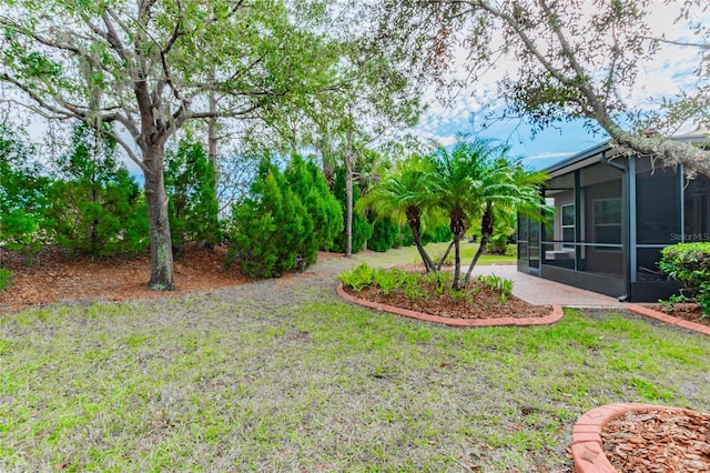 view of yard featuring a sunroom