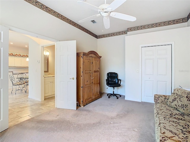 home office with light colored carpet and ceiling fan