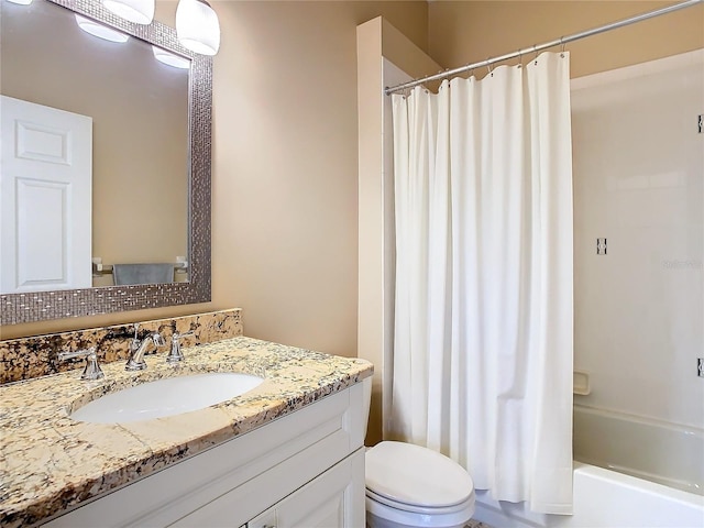 full bathroom featuring shower / bath combination with curtain, vanity, and toilet