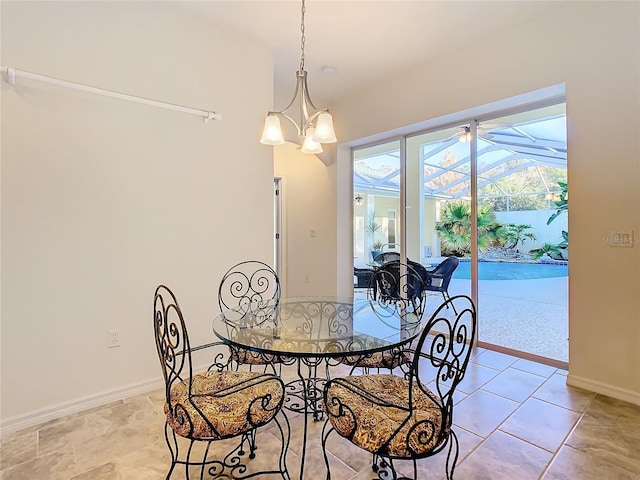 dining space with an inviting chandelier and baseboards