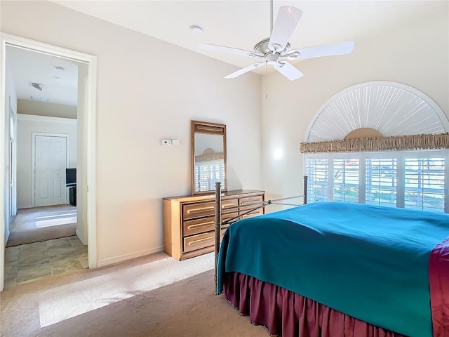 bedroom featuring ceiling fan and light carpet