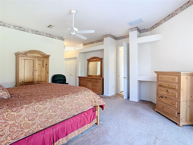 bedroom featuring light carpet, visible vents, a ceiling fan, and baseboards