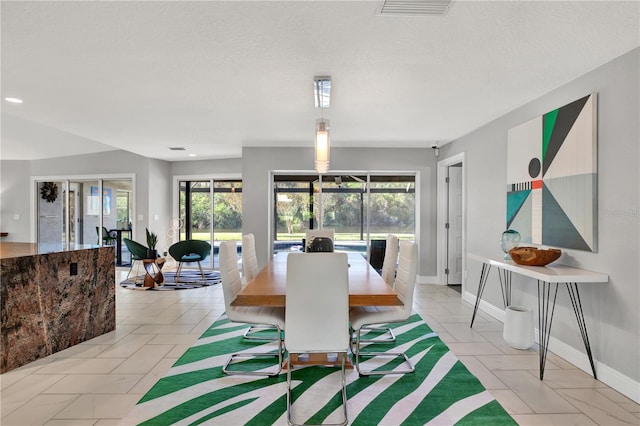 view of tiled dining space