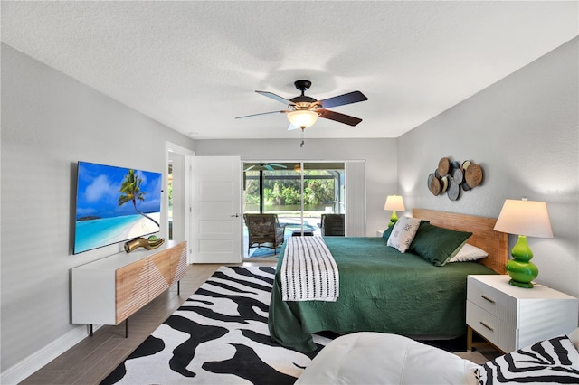 bedroom with hardwood / wood-style floors, ceiling fan, a textured ceiling, and access to outside