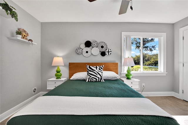 bedroom featuring ceiling fan and hardwood / wood-style floors