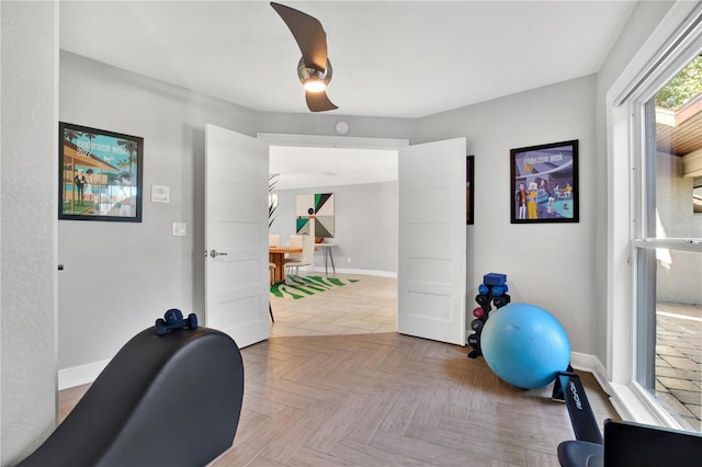 exercise room with light parquet flooring