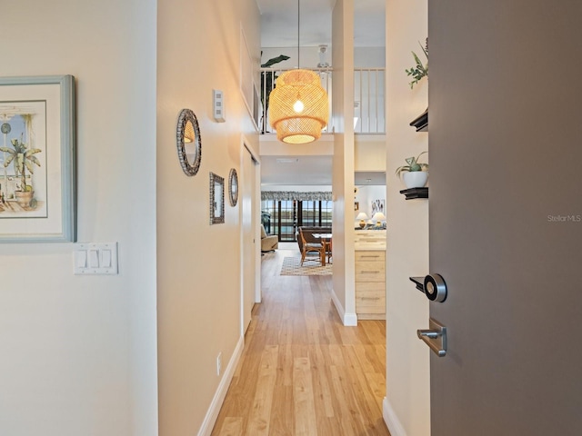 hallway with light wood-type flooring