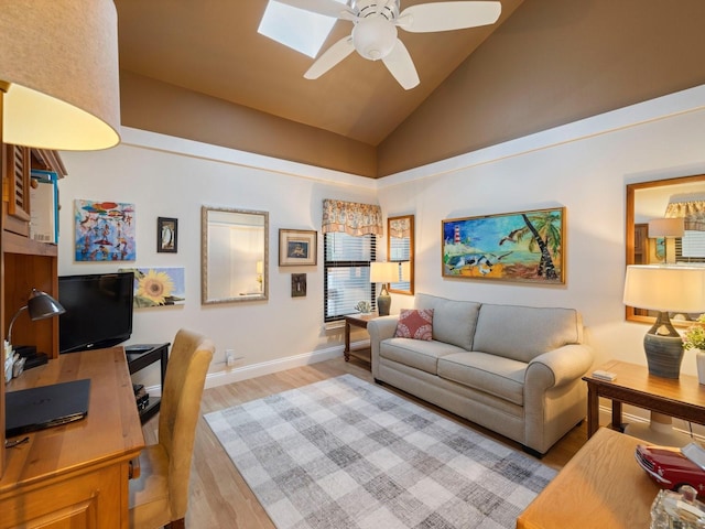 office space featuring ceiling fan, light hardwood / wood-style flooring, and high vaulted ceiling