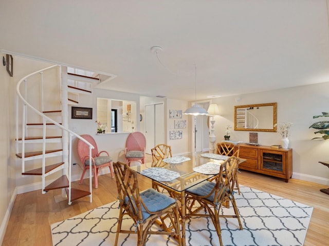 dining area featuring light wood-type flooring