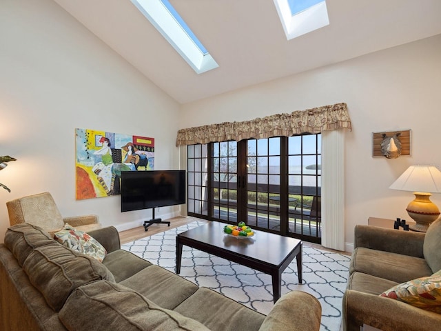 living room with vaulted ceiling and light hardwood / wood-style flooring