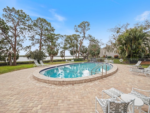 view of swimming pool featuring a patio area