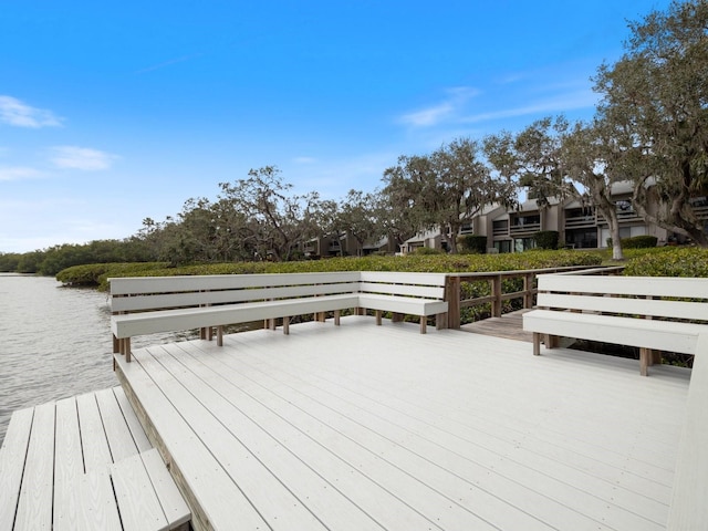 view of dock with a deck with water view