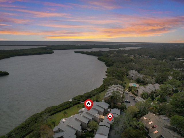 aerial view at dusk with a water view