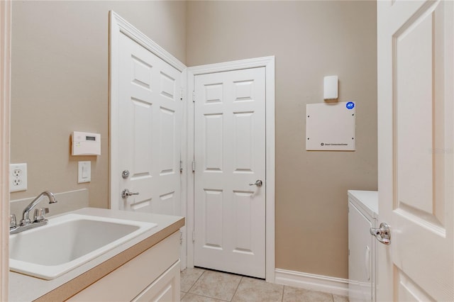 washroom with light tile patterned floors and sink