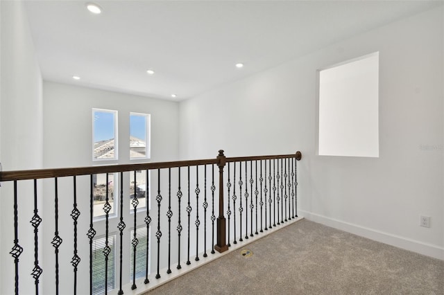 hallway with carpet floors