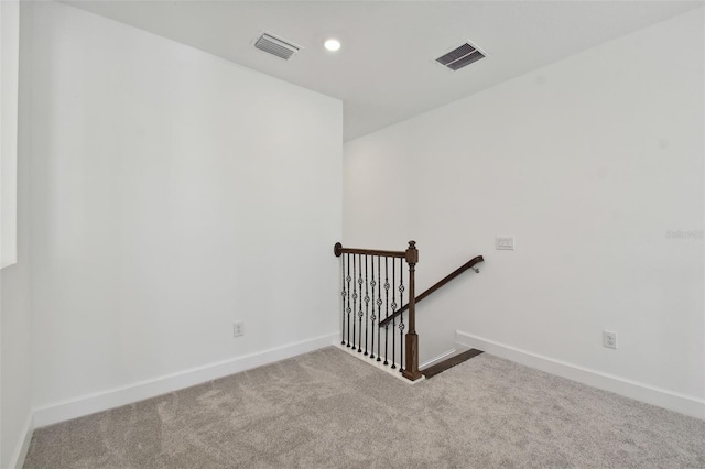 staircase with carpet flooring