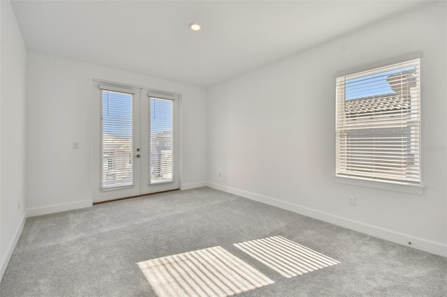 empty room with light carpet and french doors