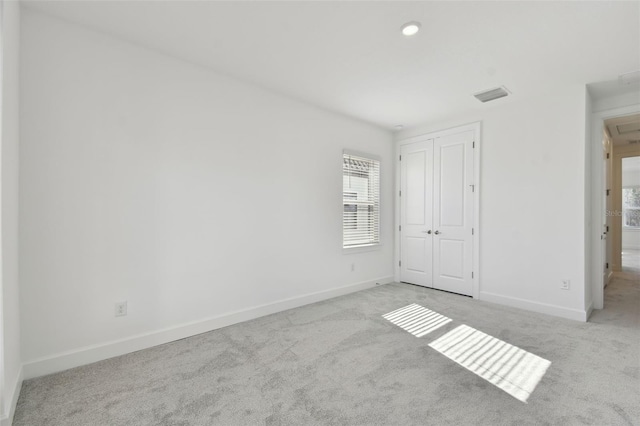 unfurnished bedroom with light carpet