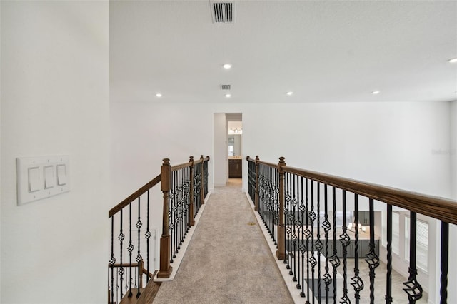 hallway featuring carpet flooring