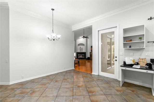 unfurnished dining area with tile patterned flooring, ceiling fan with notable chandelier, and crown molding