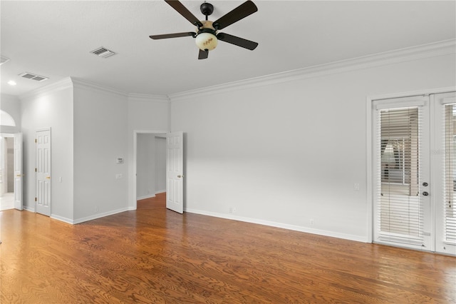 empty room featuring hardwood / wood-style flooring, ceiling fan, and ornamental molding