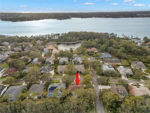 birds eye view of property with a water view