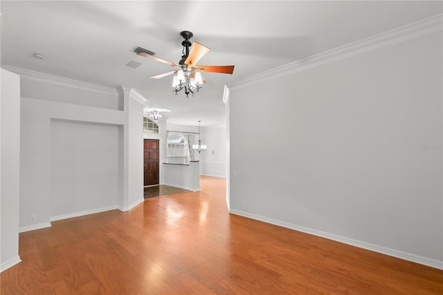 unfurnished room featuring ceiling fan with notable chandelier, ornamental molding, and light hardwood / wood-style flooring