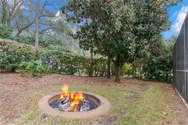 view of yard with an outdoor fire pit