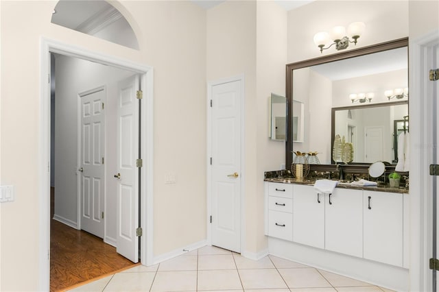 bathroom with tile patterned floors and vanity