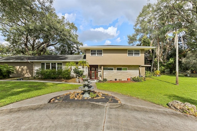 split level home with a front yard