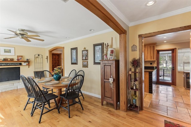 dining room with ceiling fan and ornamental molding