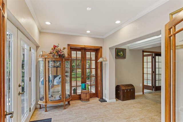 foyer with ornamental molding and french doors