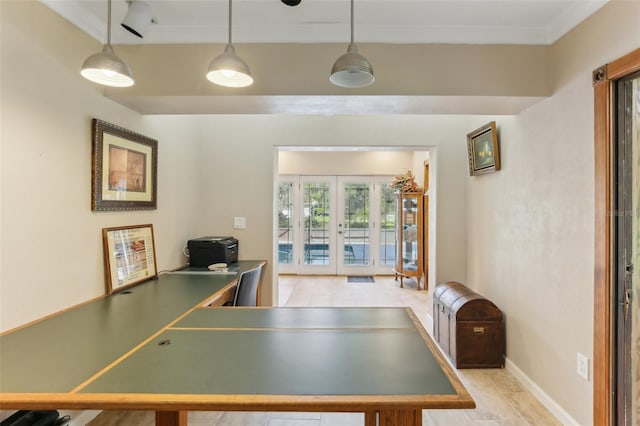 rec room with french doors and ornamental molding